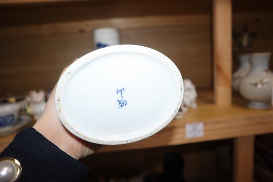 A pair of Chinese blue and white oval section sleeve vases height 25cm (one a.f.)